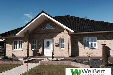 Ebenerdig wohnen mit geschützter Terrasse Winkel-Bungalow als Niedrigenergiehaus mit Wärmepumpe - Süderheistedt