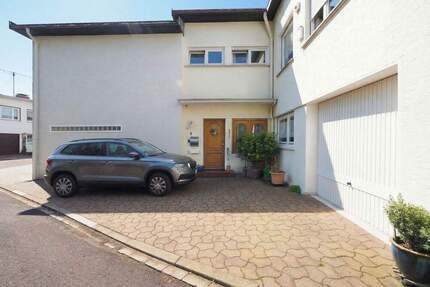 Charmantes Einfamilienhaus mit liebevoll angelegtem Garten in familienfreundlicher Lage von Saarbrücken!