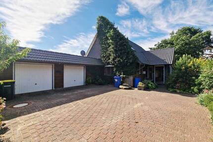 Großzügiges EFH mit vermieteter Einliegerwohnung - Wintergarten, Südterrasse & grünem Grundstück - Krempel