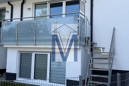 Neuwertige 3-ZKB-Maisonette mit großem Balkon, Gartenanteil und Garage im EG Souterrain - Ketsch